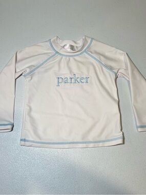 Cecil and Lou Kids White Rash Guard with Light Blue Trim and 'Parker' Embroidery